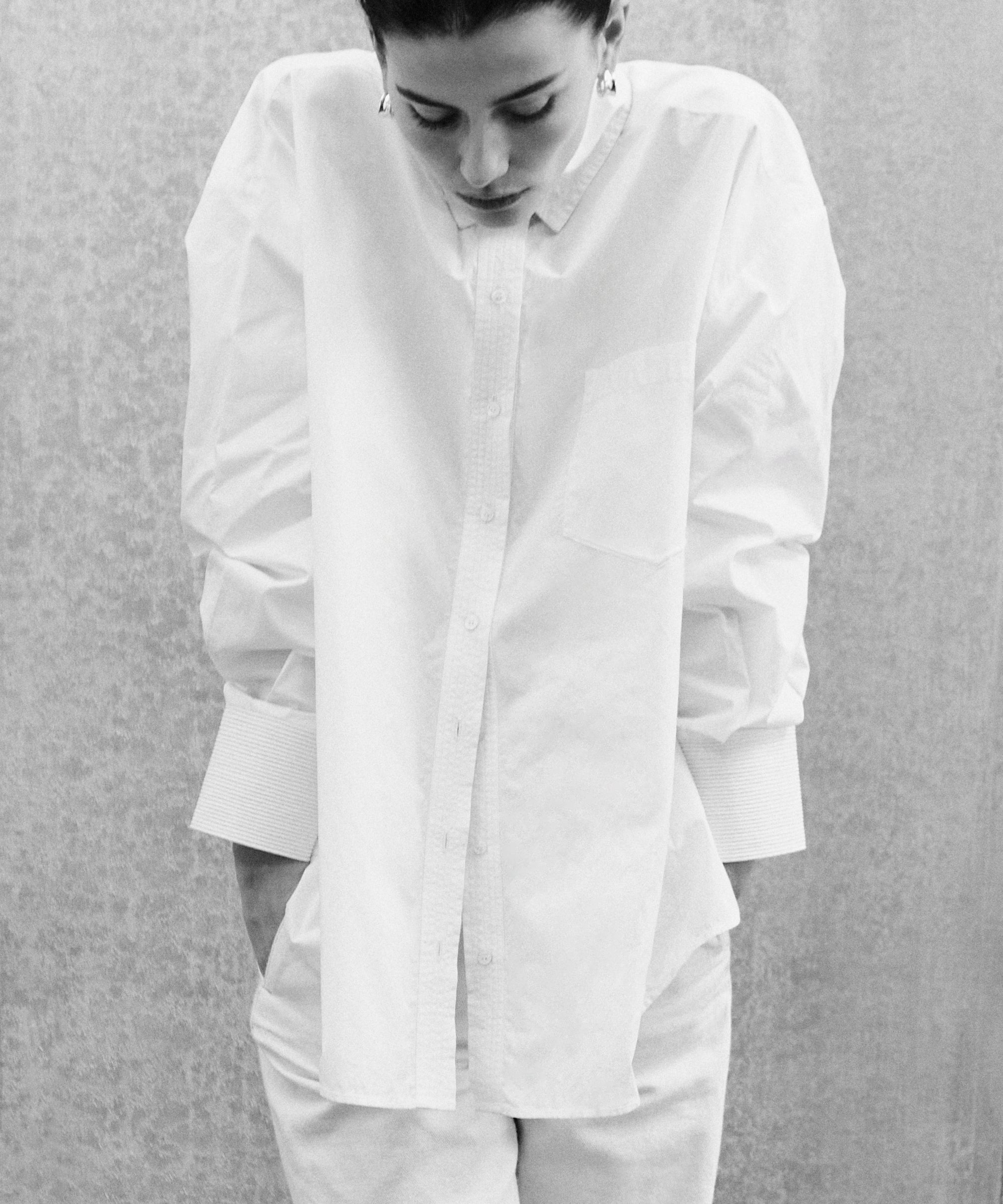 White cotton poplin ELE shirt with voluminous oversized cut and hand-embroidered details on shoulders and cuffs