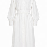 White May dress by Aymone Studio featuring voluminous sleeves, high collar, handcrafted piping, and full-length button placket, embodying refined minimalist luxury