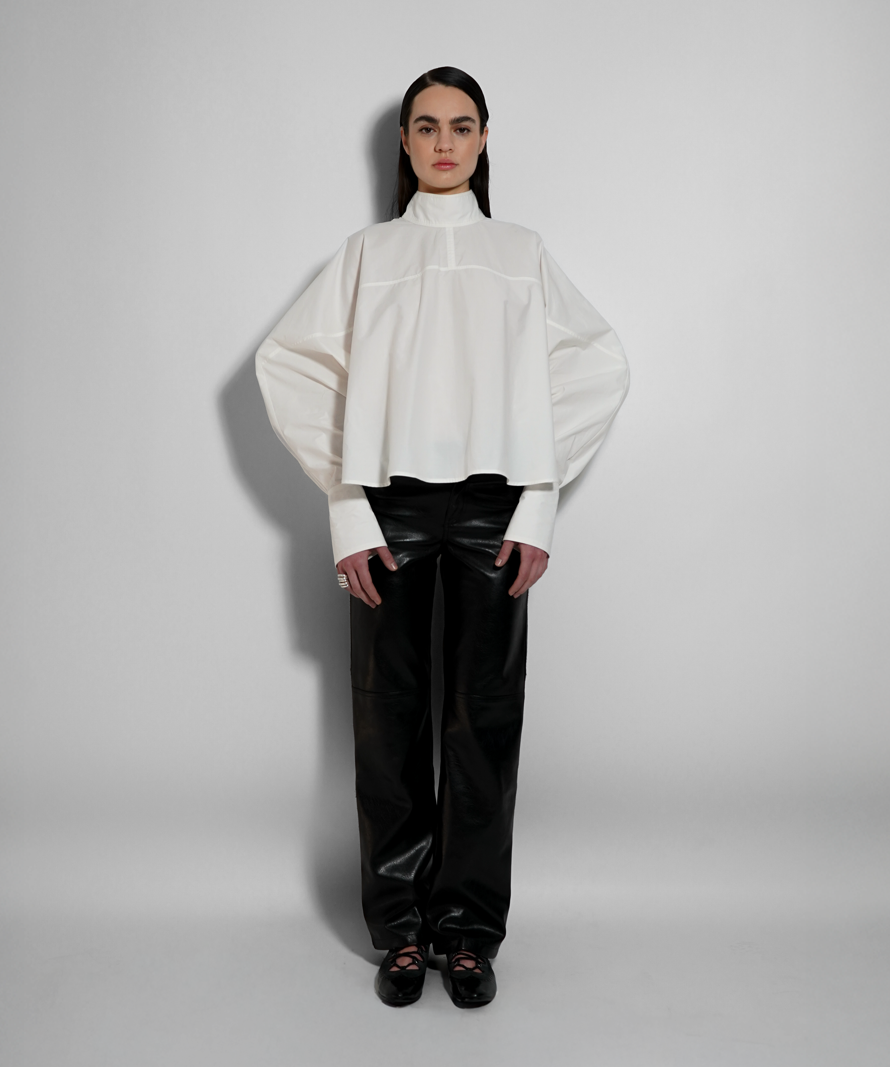 women oversized white shirt structured silhouette fluid drape elegant look