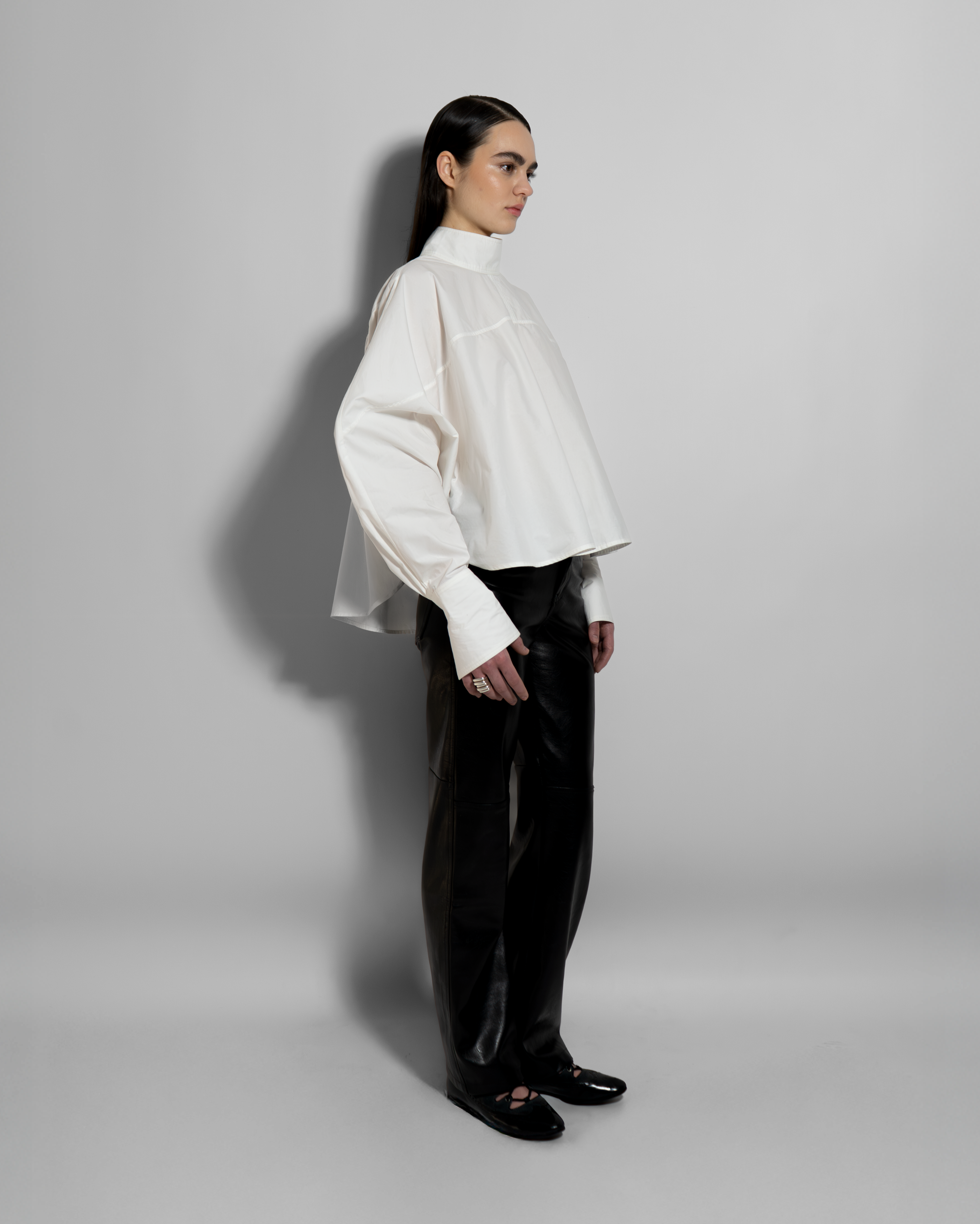 oversized white shirt women side view relaxed fit structured volume