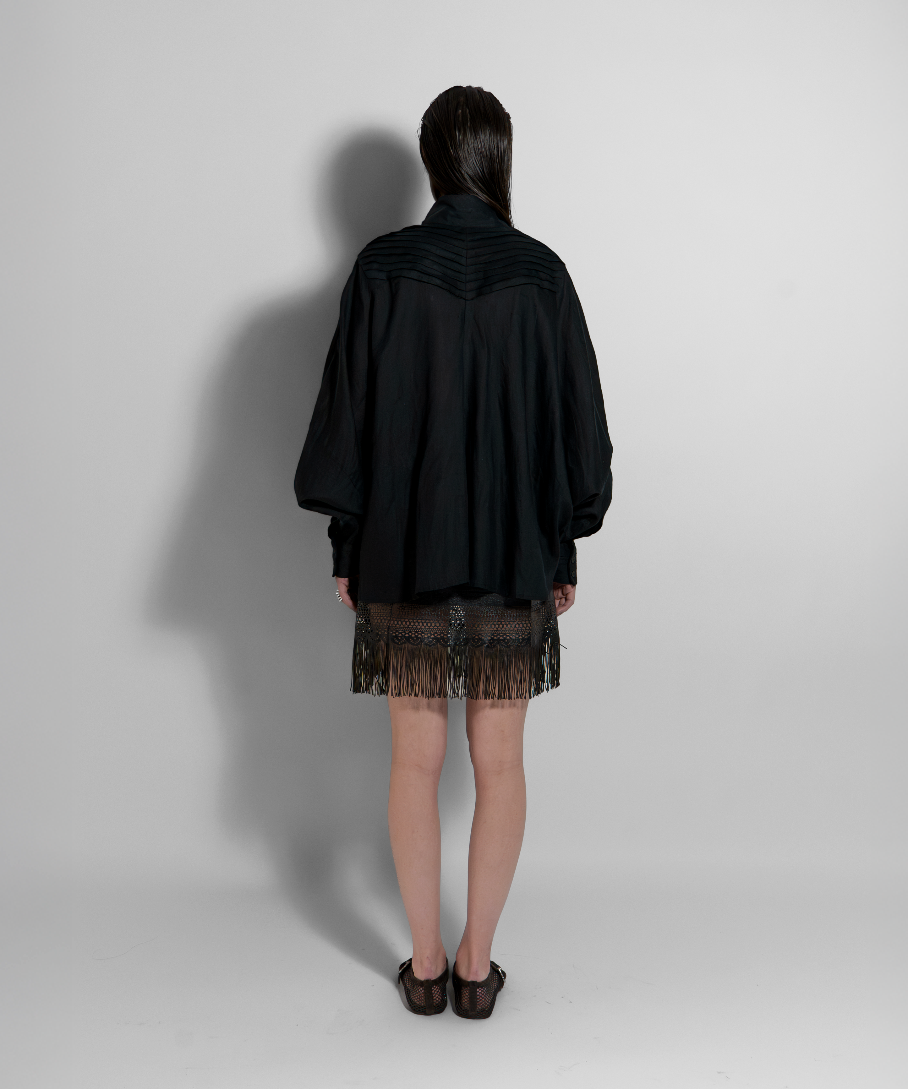 Back view of CATE black linen shirt by Aymone Studio, luxury Italian linen essential with sculptural volume and minimalist design