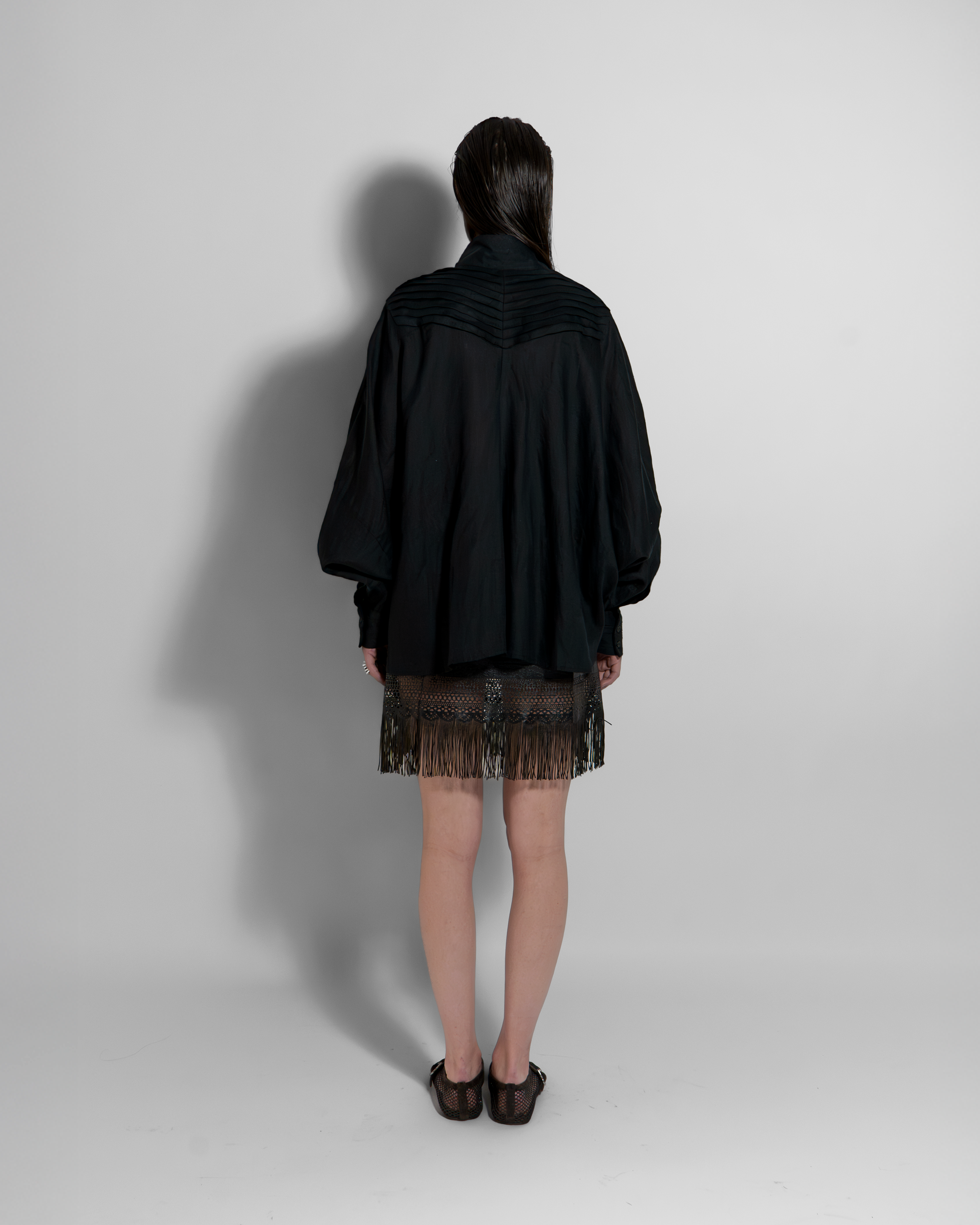 Back view of CATE black linen shirt by Aymone Studio, luxury Italian linen essential with sculptural volume and minimalist design