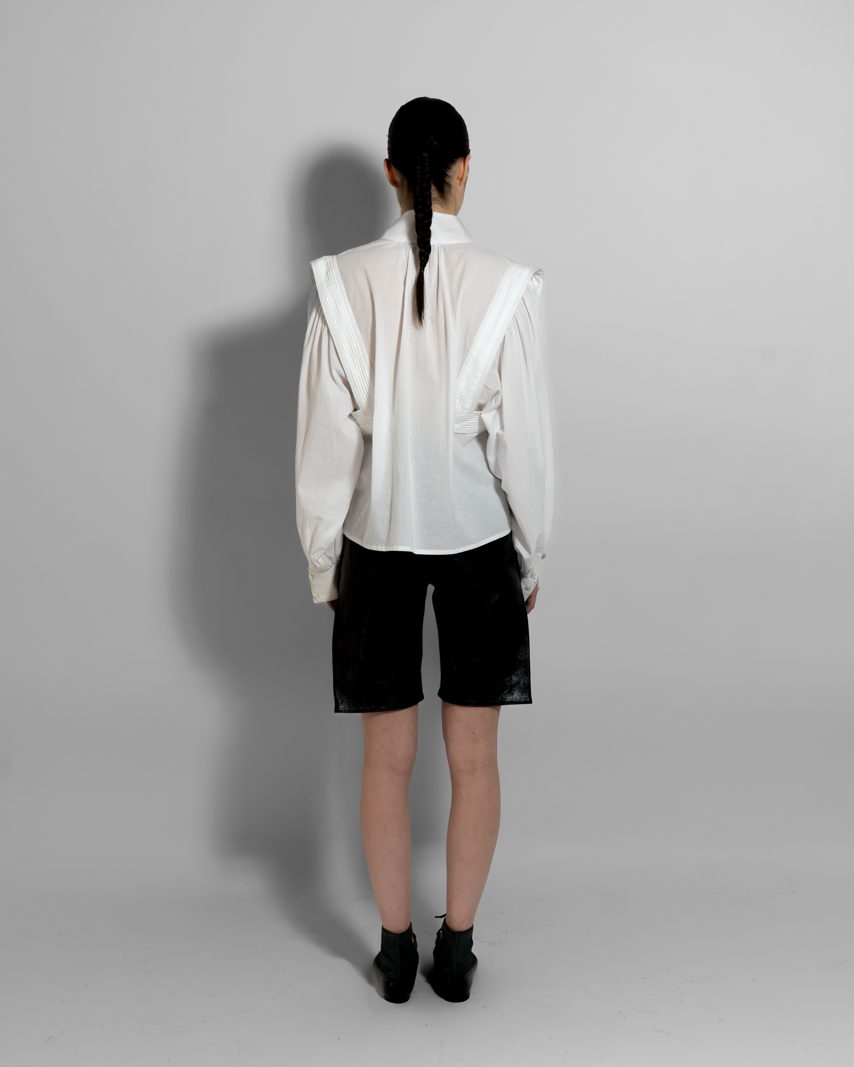 MAY white cotton voile shirt with sculptural oversized sleeves and hand-stitched embroidery, rear view on model