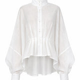 Cate white linen shirt with sculptural pleats, structured collar, and fluid oversized silhouette by Aymone Studio